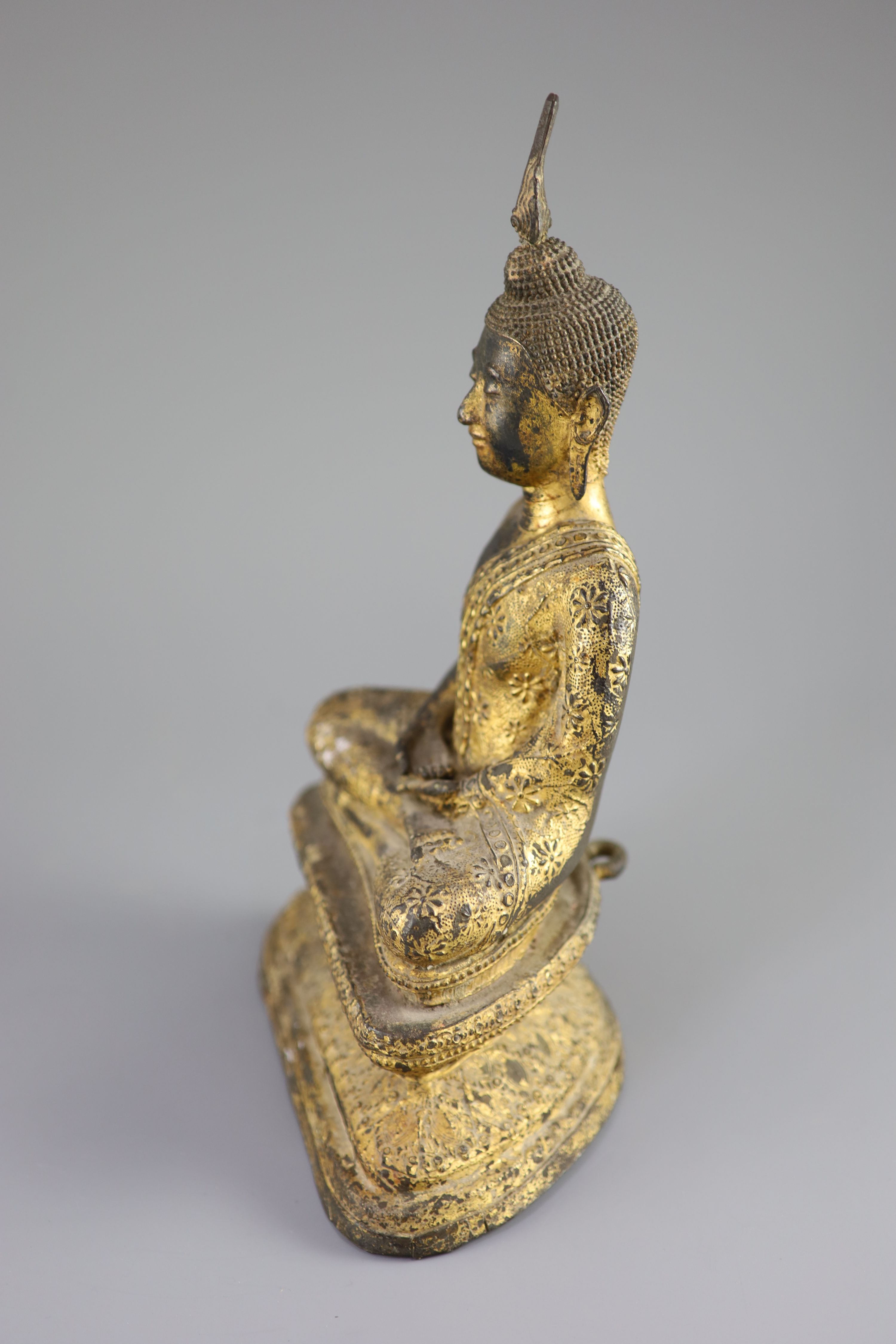 A Thai gilt bronze seated figure of Buddha, 18th/19th century, 33 cm high